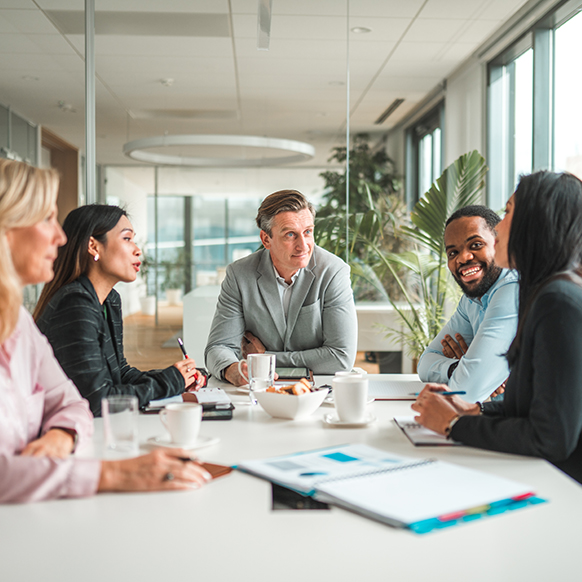Berkley Human Services professionals in conference room discussing underwriting appetites