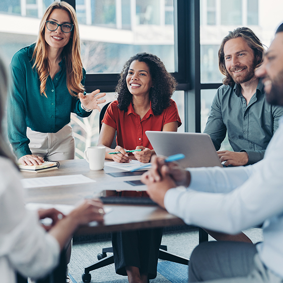 BHS financial team in conference room in discussion with each other