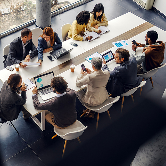 Aerial view of BHS financial team and other practices around conference table