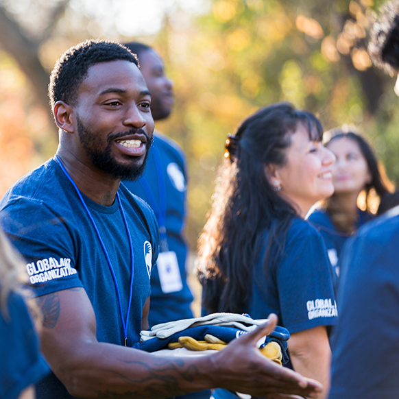 African American man volunteering at nonprofit for job training and workplace development programs
