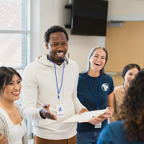 African American man working with individuals at a job training program