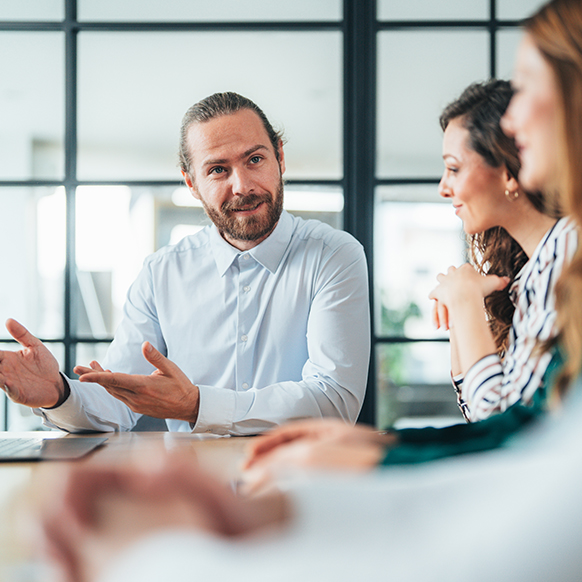 Human Services Actuarial team discussing strategy for insurance carrier