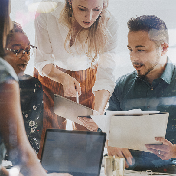 Insurance professionals collaborating on underwriting details