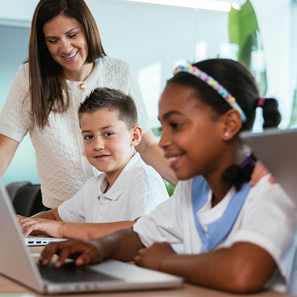 Young children getting after school education support from teacher