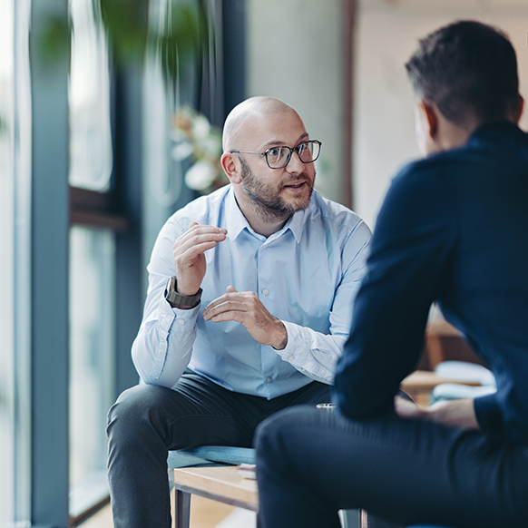 Insurance underwriter and producer discussing coverage in detail