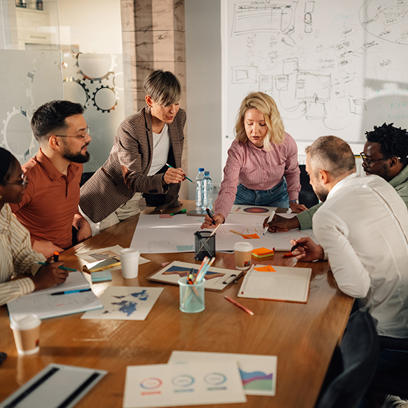 Professional insurance team working together around conference table